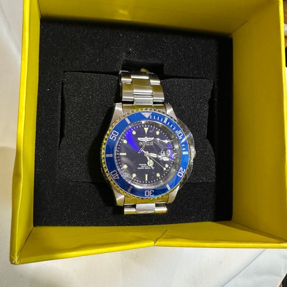 Invicta Stainless Steel Watch with Yellow Accents